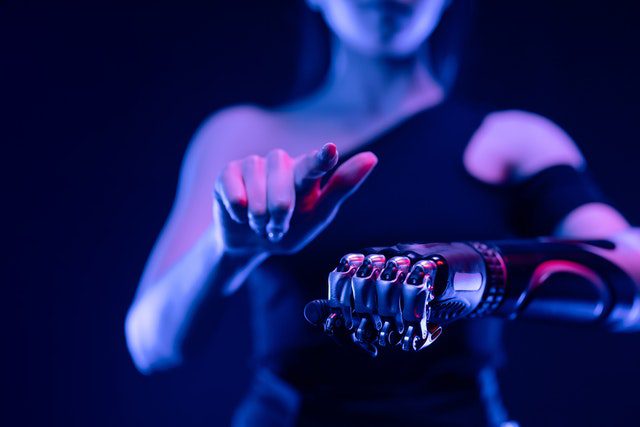 growthland woman with robotic arm